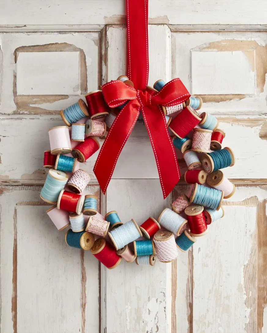 Go-green-by-upcycling-spools-into-a-wreath-as-Christmas-decoration.webp