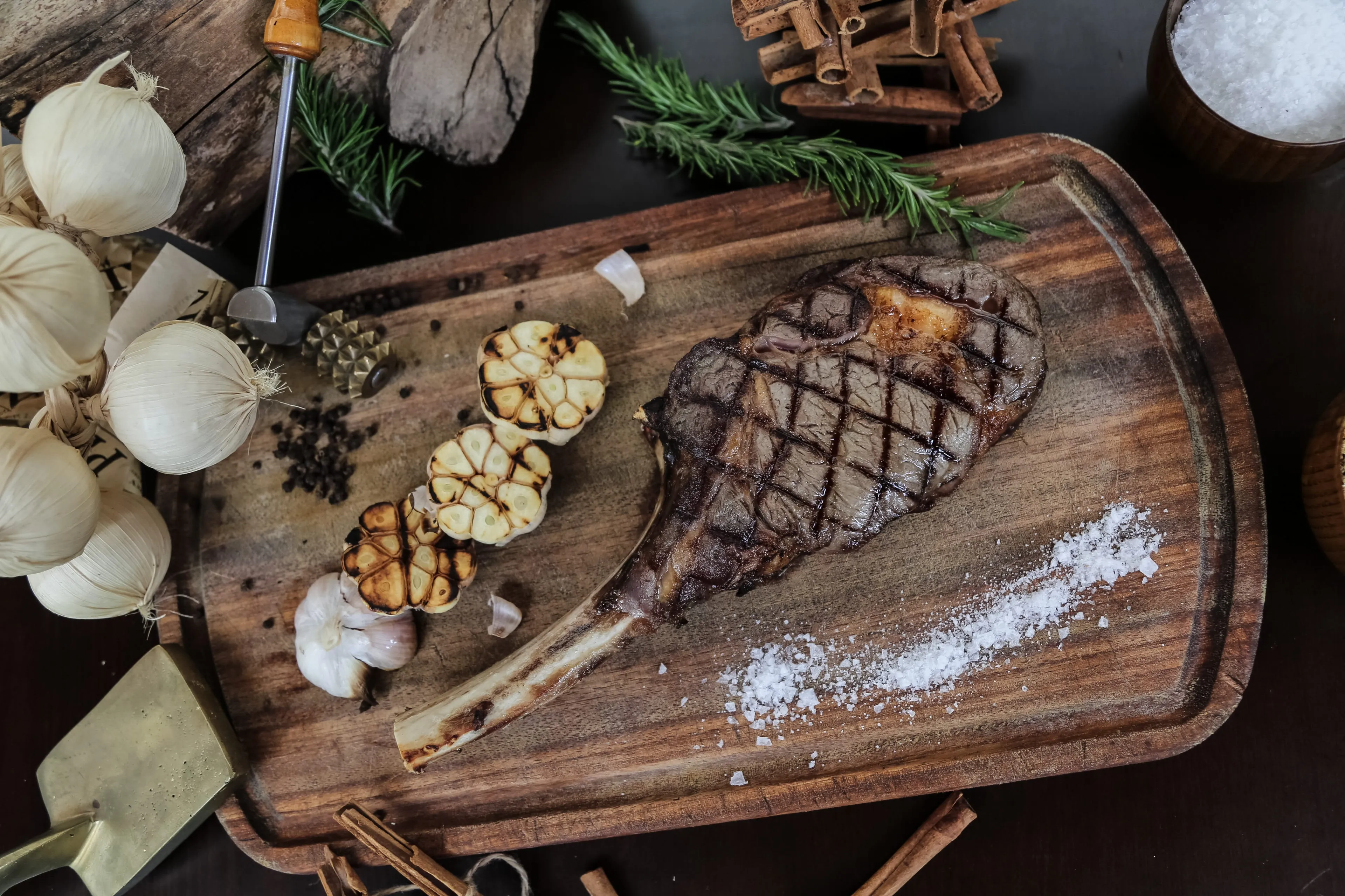 grilled steak wooden board garlic salt rosemary min